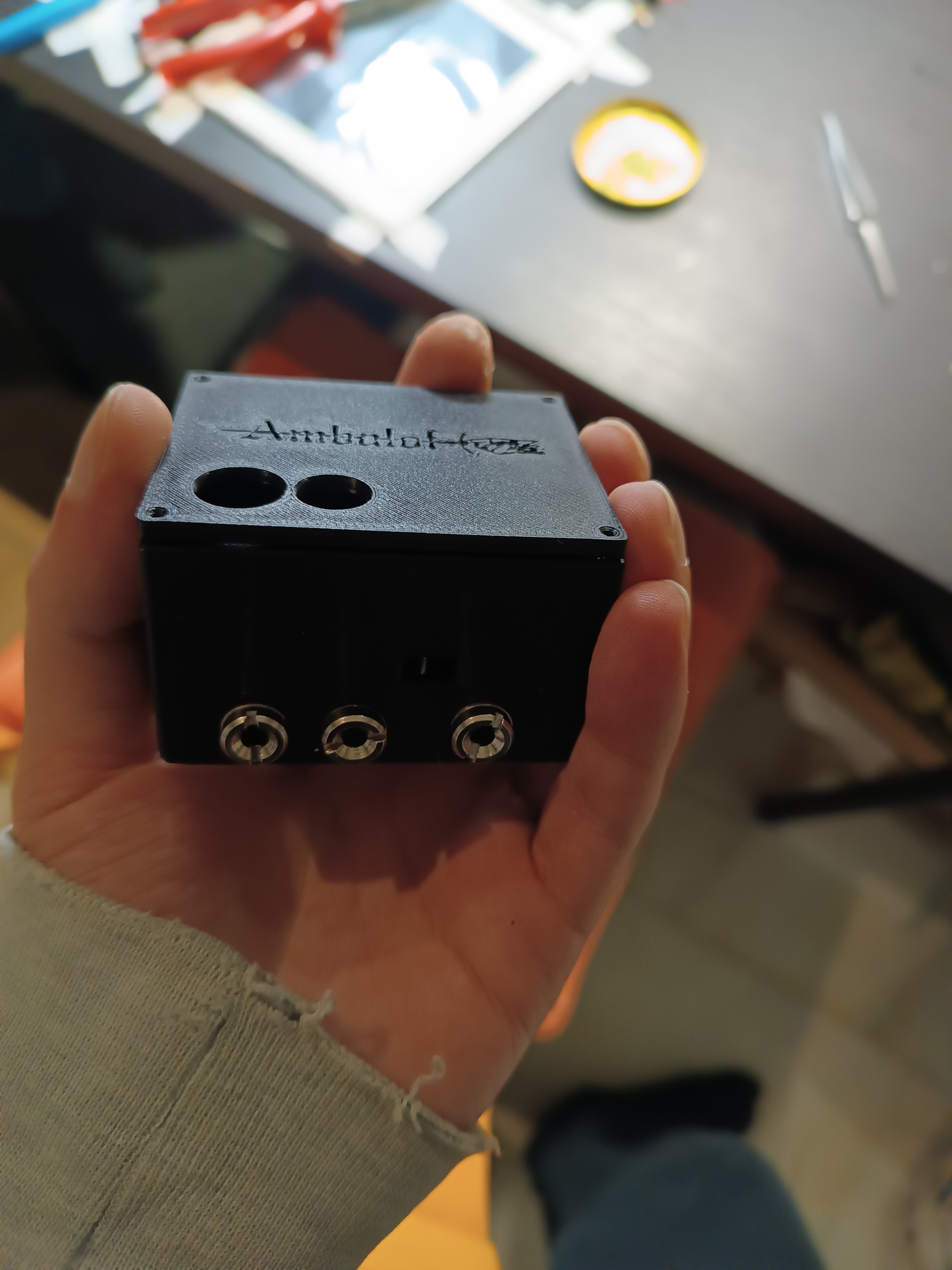 Finished 3D-printed black enclosure with three 1/4 inch jack connectors and two cable glands