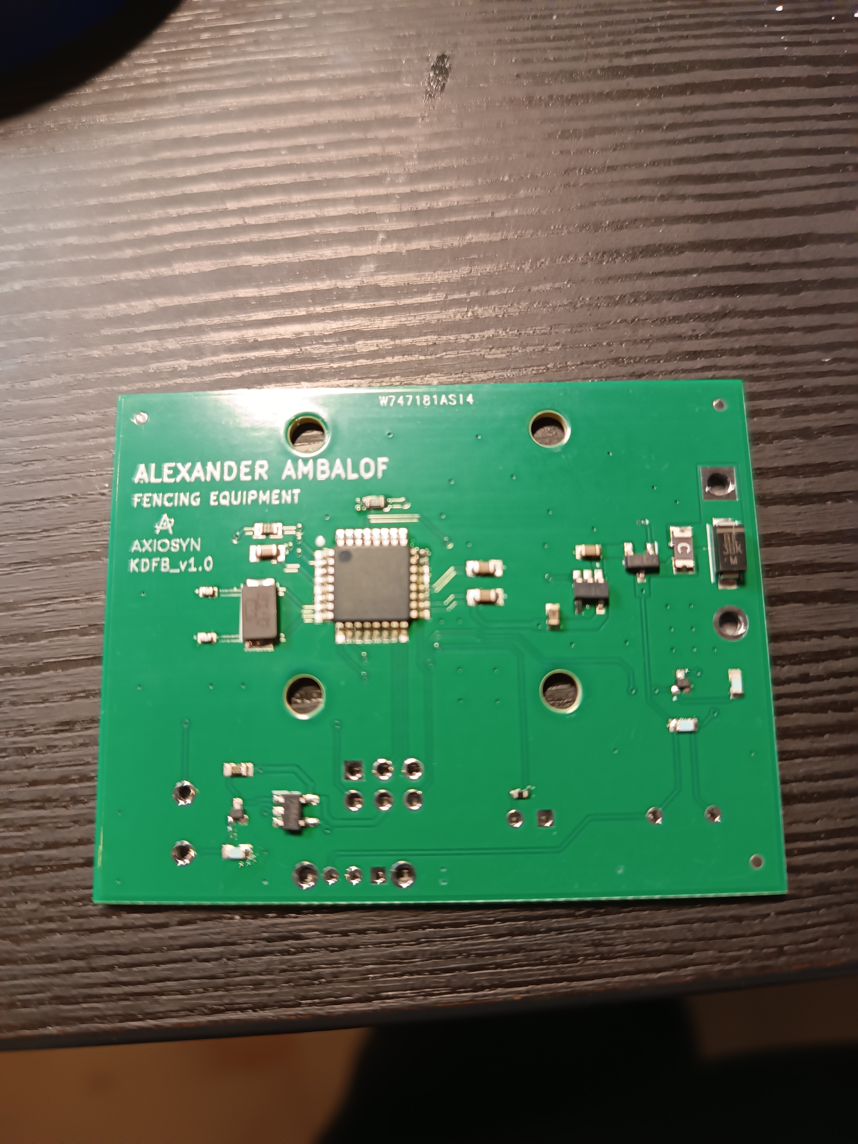 Angled view of the populated PCB on the workbench